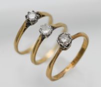 Three 18ct gem set rings, approx 7.20g.