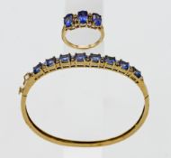 A 14k yellow gold bangle set with diamonds and tanzanite's, approx total weight of tanzanite 5.