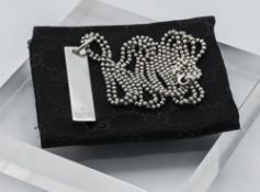 Gucci, a silver Gucci pendant on chain, with Gucci cloth pouch.