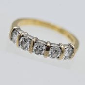 An 18ct gold five stone modern brilliant cut diamond half eternity set ring, approx 1.05ct total