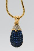 An 18ct yellow gold sapphire and diamond pendant in a shape of a pineapple, blue sapphire set in a