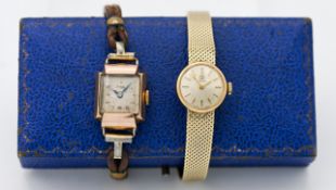 A ladies 18ct yellow gold Tissot wristwatch on a milanese bracelet, with silver baton dial, approx
