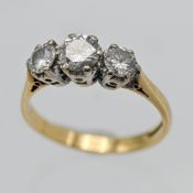 An 18ct diamond three stone ring, set with modern brilliant cut diamonds, approx 0.95ct, finger size