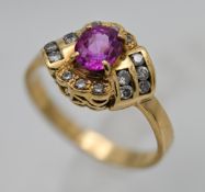 An 18ct stylish gem set ring, set with an array of diamonds, size O.