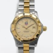 Tag Heuer, a ladies two tone, 1000 series, champagne dial, quartz movement, model number WK1321-0,