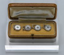 A set of four 9ct white gold shirt buttons, approx 6.15g