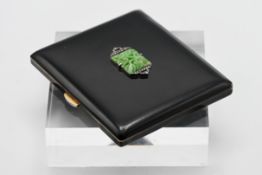 A black enamel compact fitted with a with mirror, the case set with carved jade and marcasite in a