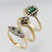Two 18ct yellow gold gem set rings together with an unmarked gem set ring (3).