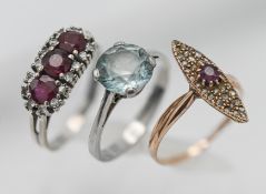 Three gem set rings, not hallmarked.