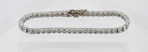 An 18ct white gold diamond line bracelet, diamond weight approx 5.12ct, length 17cm, with forty