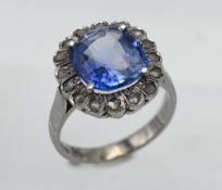 A fine sapphire and diamond cluster ring, cushion cut, sapphire assessed as Ceylon Pale blue