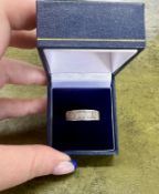 A half channel white gold ring, 18k white gold set, 9x baguette cut diamonds, size O/P, approx 6.5g,