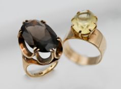 A 9ct yellow gold ring set with large stone together with another ring set with dark stone (hallmark