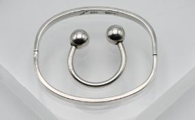 A small hinged cuff bangle, cushion shape in silver, stamped 925, 16.3g together with a torque style