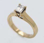 An 18ct single stone diamond ring, millennium cut diamond 0.66ct, twist claw mount. finger size.