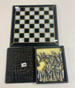 A soldier chess set with board and box for pieces, in addition to a silver service. (incomplete)