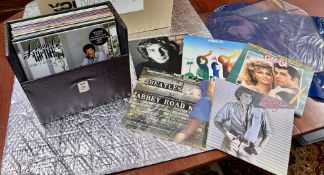 A collection of twenty-six vintage vinyl in a record box, covering movie soundtracks and various