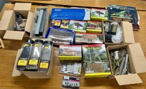 A collection of model buildings, model canal barges and model locomotive carriages, makes by