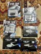 A collection of 'Star Trek Discovery: The Official Starships Collection' boxed models, three with