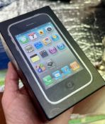 A boxed iPhone 3GS, Black, 8GB- with a charging cable. First launched in June of 2009.