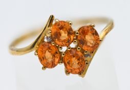 Gemporia, a 9k gold tangerine garnet and diamond ring, with certificate of authenticity card and