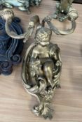 A 19th century gilt wall sconce with cherub, height 45cm.