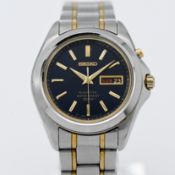 Seiko, a gents Kinetic two tone with blue baton dial, boxed and papers together with a Kinetic watch