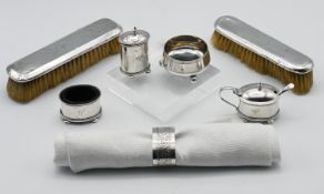 A silver napkin ring, a 3 piece George V silver condiment set and mustard spoon (silver weight