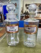 Two glass medicine bottles.