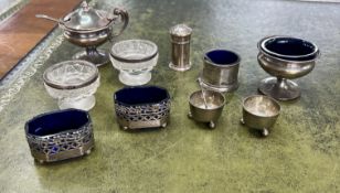 A small collection of silver objects including table salts, mustard pot, pepper pot etc.