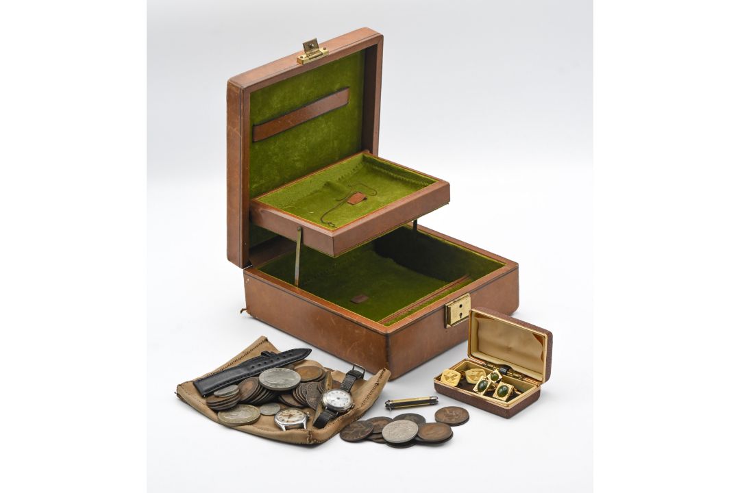 A leather cased jewellery box containing a vintage silver cased ladies wristwatch with 'red 12'