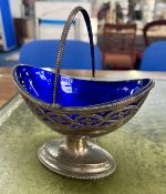 A silver basket with handle with blue glass liner, London, circa 1884-85, maker Joseph, Albert,