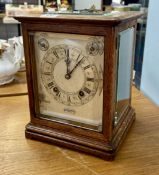 A 19th century mantle clock, possibly a railway clock, marked Pearce and Sons, Leeds with silver