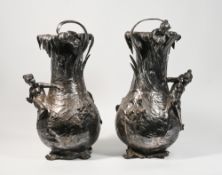 WMF, a pair of large nymph floor vases, maximum height 58.5ocm, a tear damage at the base to one,