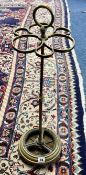 Old brass stick stand and a patterned rug, 225cm x 166cm.
