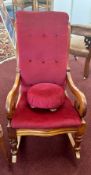 A Victorian mahogany rocking chair.
