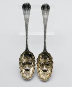 A pair of Georgian silver and gilt fruit spoons, approx 4.70 ounces.