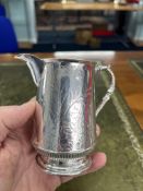 A Victorian silver cream jug, Sheffield, decorated with bird, butterfly and ferns, approx 5.94oz.