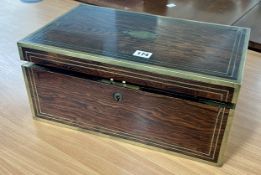 A 19th century campaign rosewood writing box with brass mounts, interior fitted with a writing slope