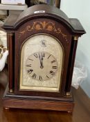 An Edwardian mahogany inlaid case mantle clock, with eight day movement, striking on the gong with