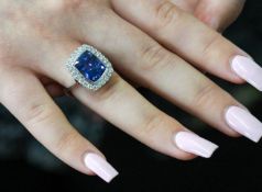 A fine 18ct white gold diamond and tanzanite ring, with rub over setting, tanzanite weight 6.72ct,