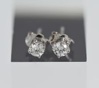 A pair of 18ct white gold diamond stud earrings, total diamond weight 0.50ct.