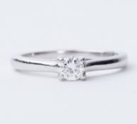 A platinum 'The Leo Diamond' solitaire ring set with a round brilliant cut diamond, approx. 0.26