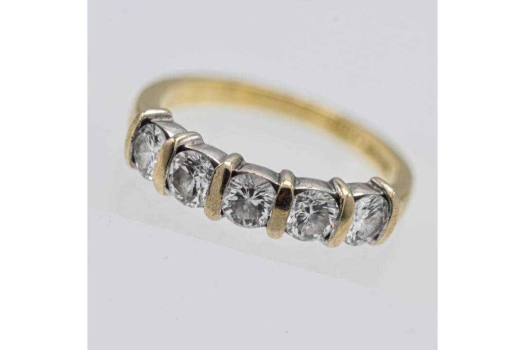 An 18ct gold five stone modern brilliant cut diamond half eternity set ring, approx 1.05ct total