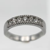A diamond half band eternity ring, set in 18ct white gold, diamond weight 58 points, size M.