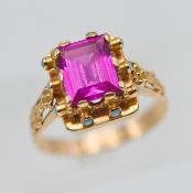 A continental antique gold dress ring set with pink tourmaline and turquoise, stamped on the outside