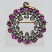 An Edwardian period ruby and diamond set circular pendant, diameter 24mm.
