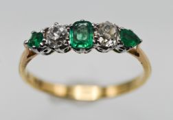 An 18ct emerald and diamond five stone ring, size P.