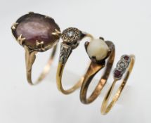 Two 9ct gold dress rings, approx 4.7g together with two 18ct yellow gold dress rings, approx 3.5g.