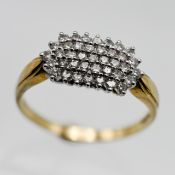 A diamond set cluster ring, with four row of modern brilliant cut diamonds, size W.